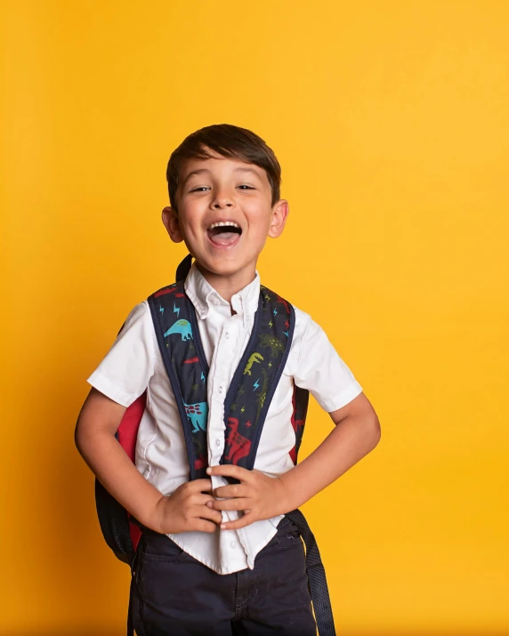 a boy in an unoned shirt and tie stands with his mouth open