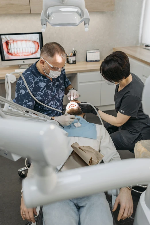 two dentists doing  in a dental office