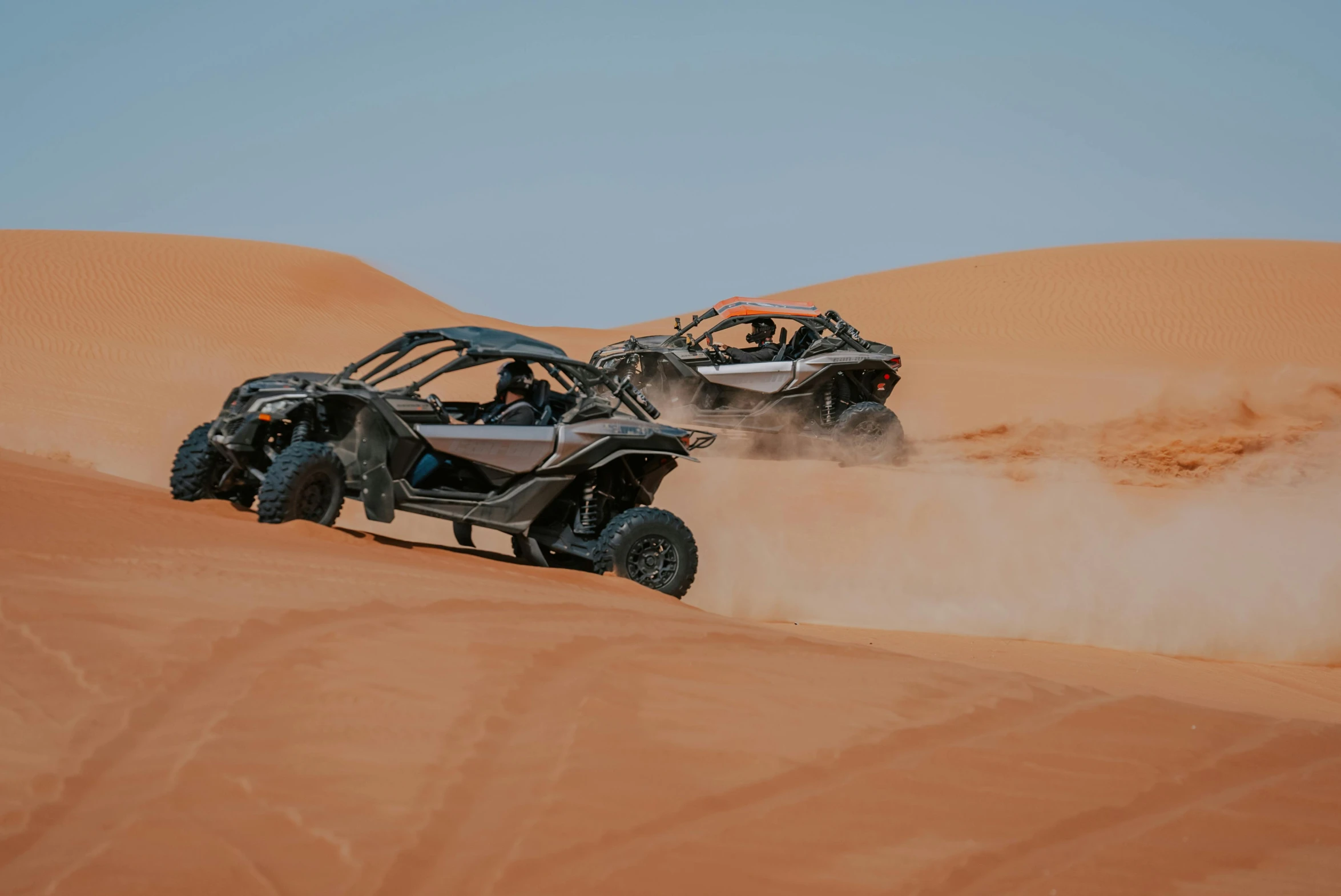 three buggy riding in the sand dunes