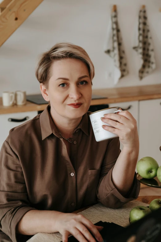 a lady is sitting down holding a card