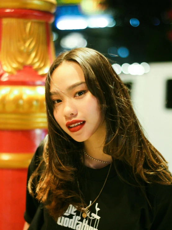 a woman with long hair and an orange lipstick