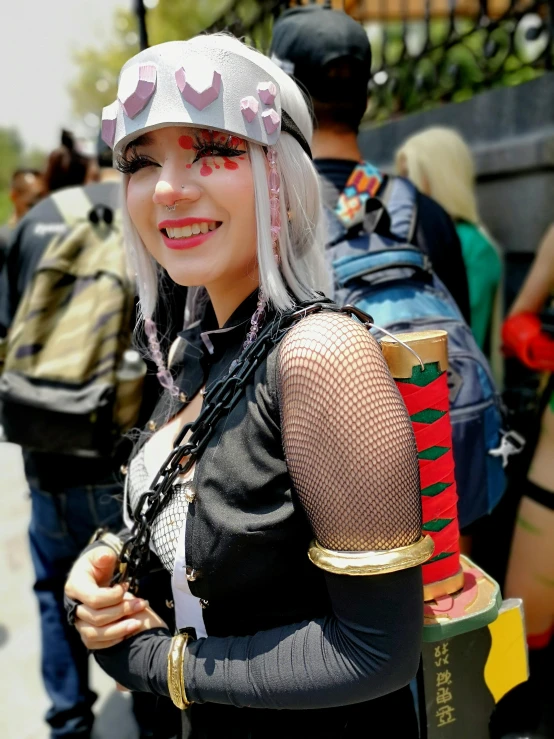 a woman in an anime costume stands with a backpack