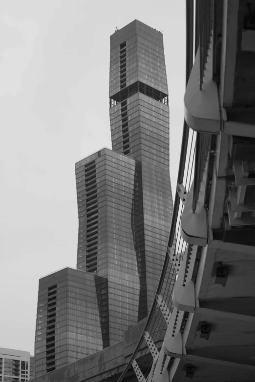 a very tall building sitting next to other large buildings