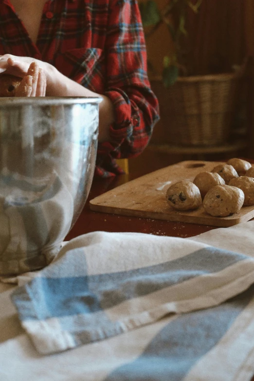 a woman mixes some kind of dessert in a bowl