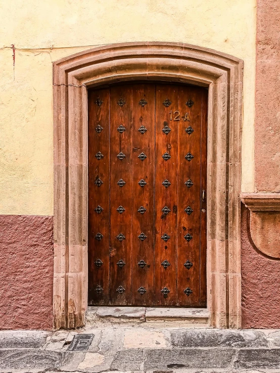 an old door is closed on a building