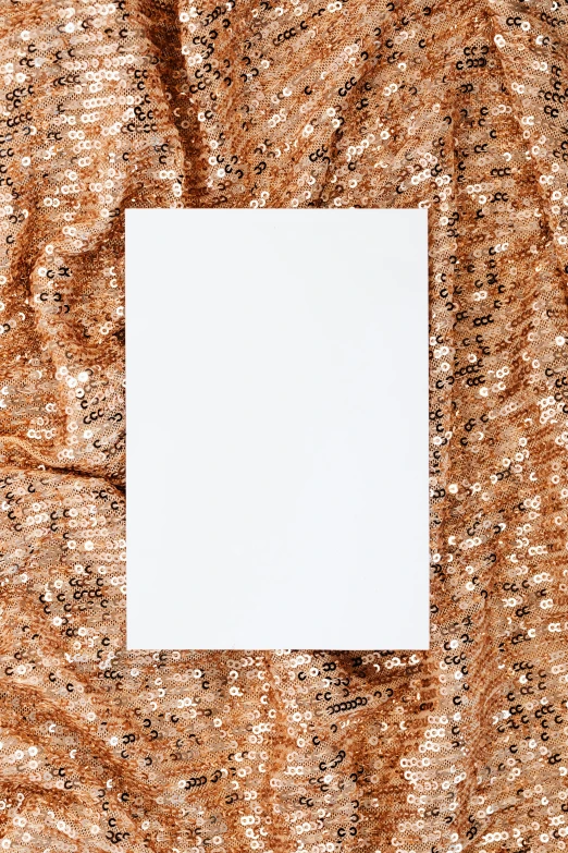 white square paper placed on brown cloth