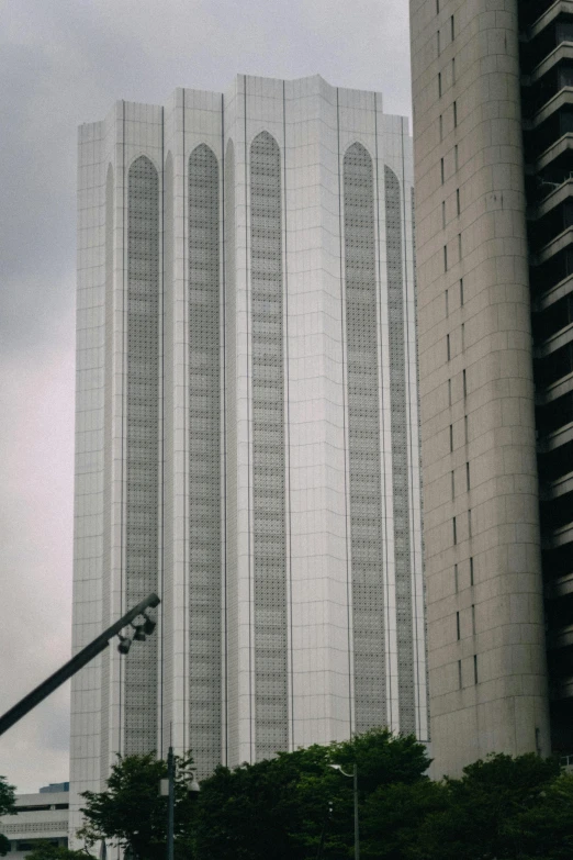 a tall, white building with intricate glass