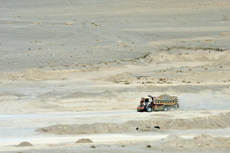 a dirt truck in the middle of desert