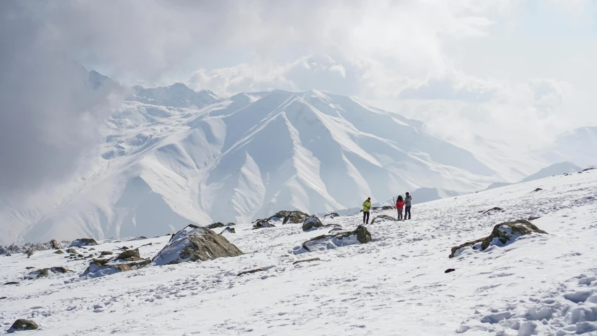 two people are hiking in the snow