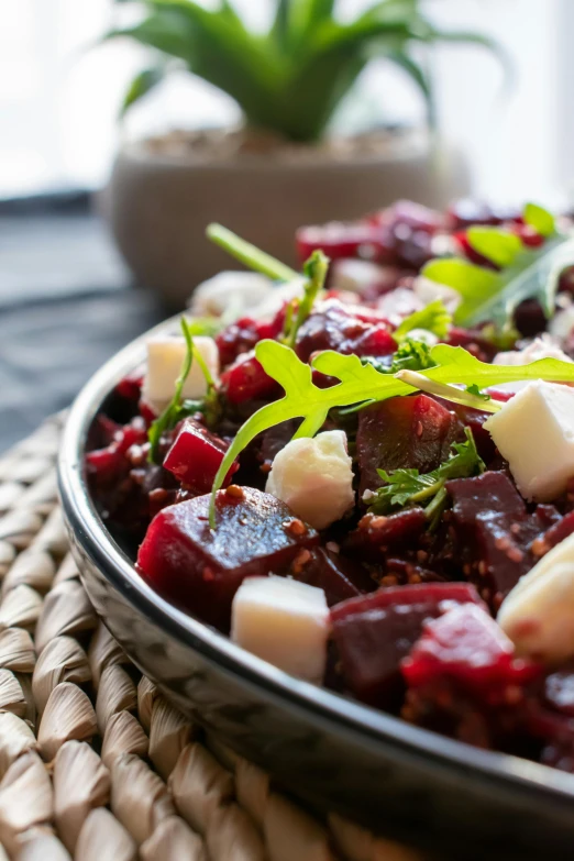 a platter with beets, cheese, and broccoli