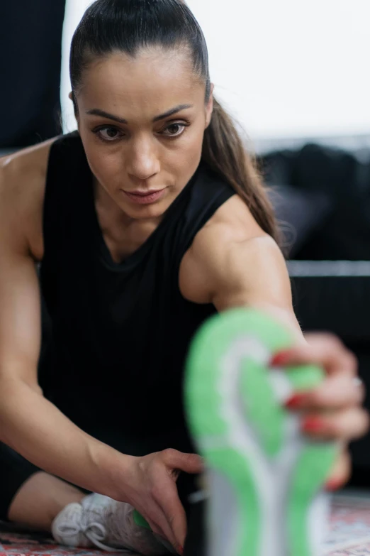 woman looking at soing while holding a racket