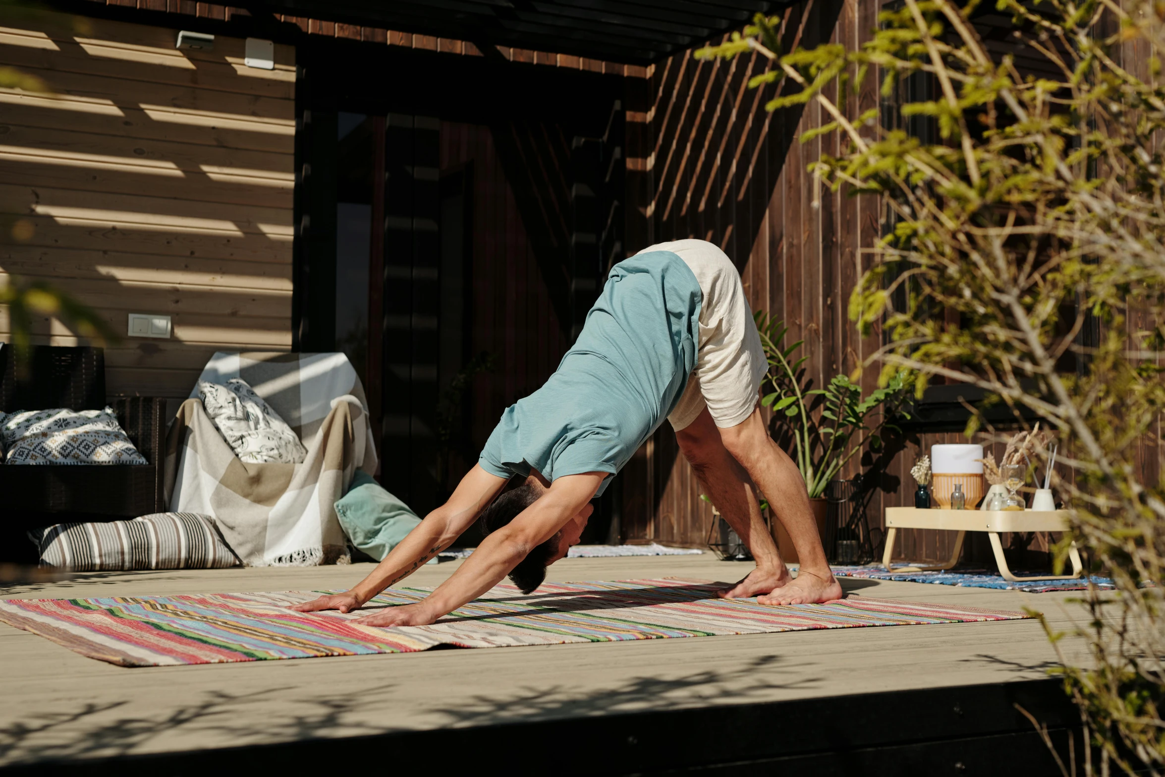 a person is doing some stretching exercises on a yoga mat