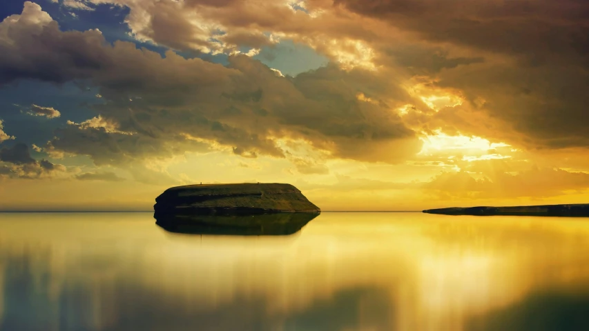 a rock is in the water on a calm day