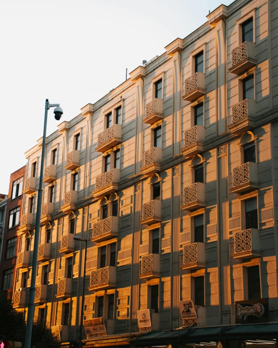 many windows in a large building that are yellow