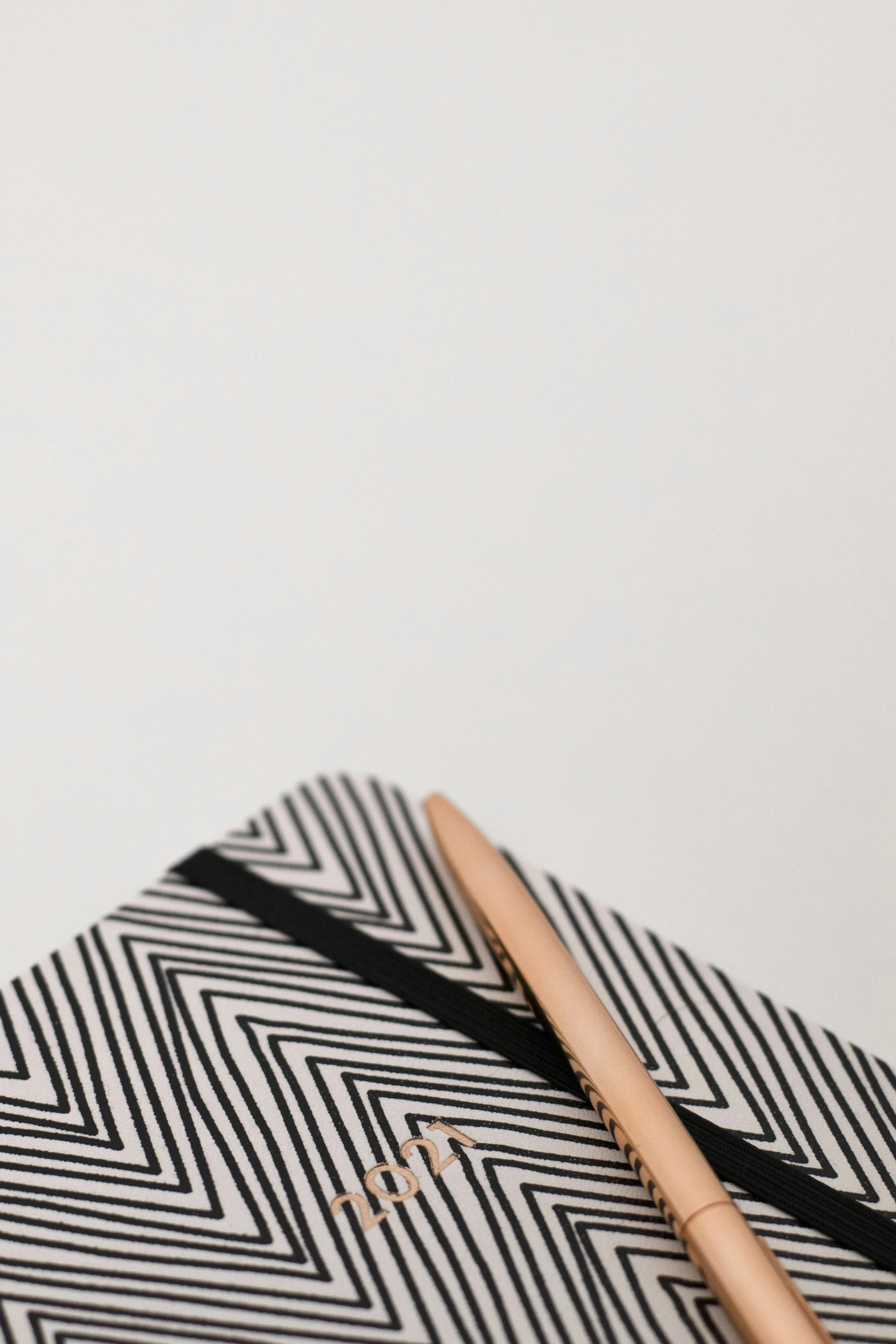 a pen and a notebook are on a table