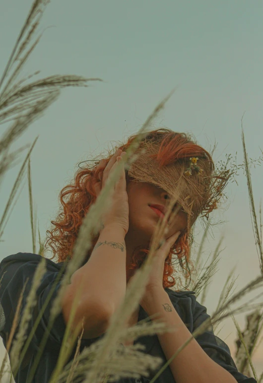 a woman is looking back into the distance from her ear