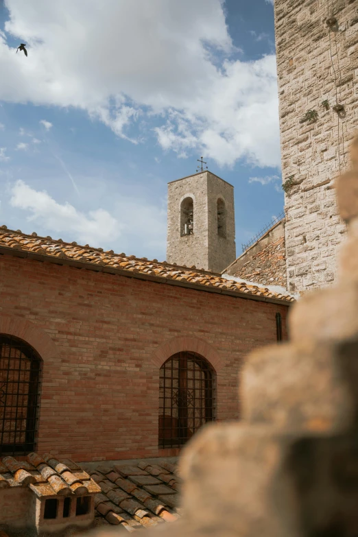 a small tower on the top of a brick building