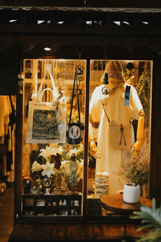 a shop window with a mannequin and flower shop