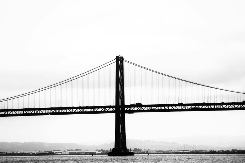 a large bridge over water in a city