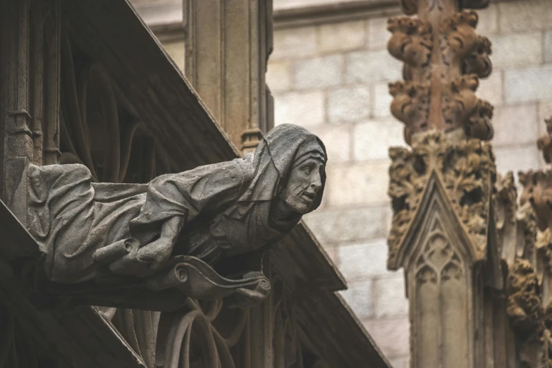 a statue in front of a building with many ornate spires