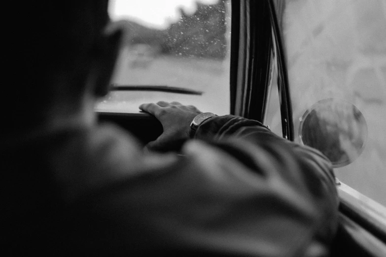 a person sitting by a window on a bus