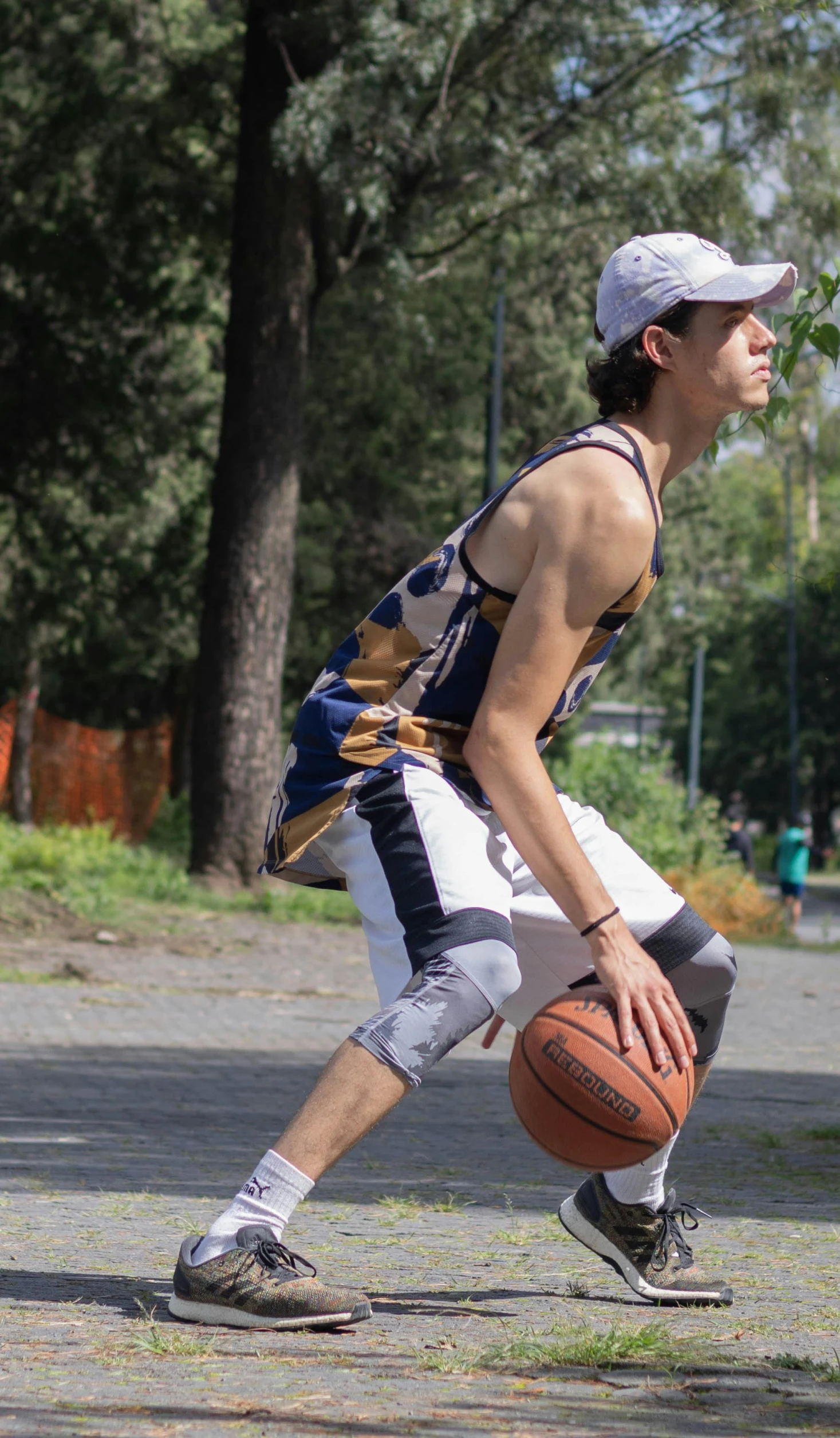 there is a male basketball player playing basketball