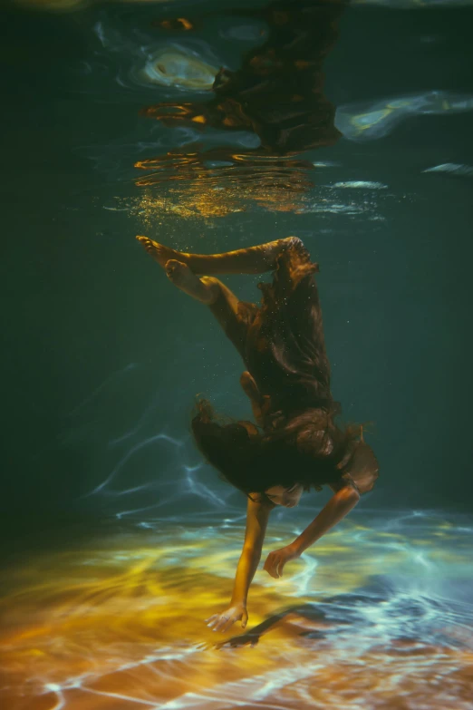 a man is standing in the water underneath water