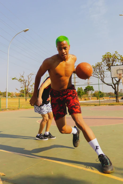 an image of a man playing basketball on court