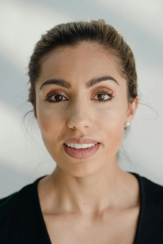 a woman looks into the camera while she is looking ahead