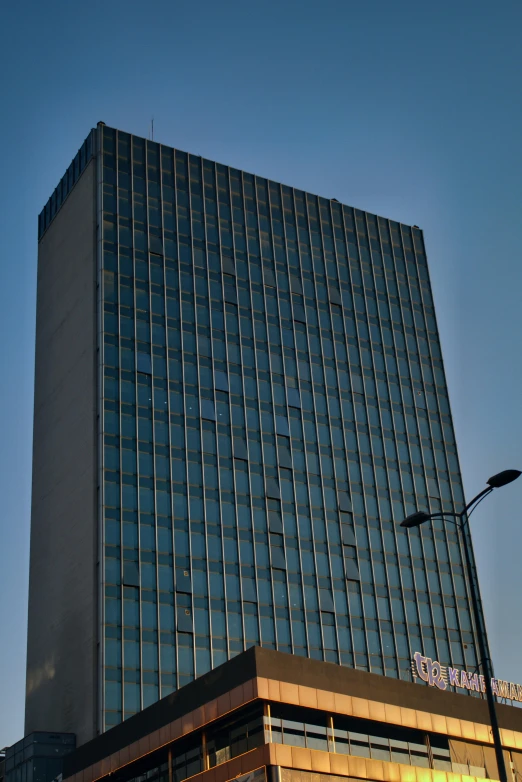 a tall building with a large triangular glass facade