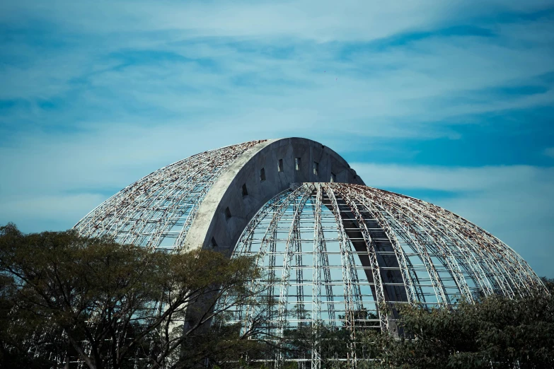 a large dome structure with several metal pillars
