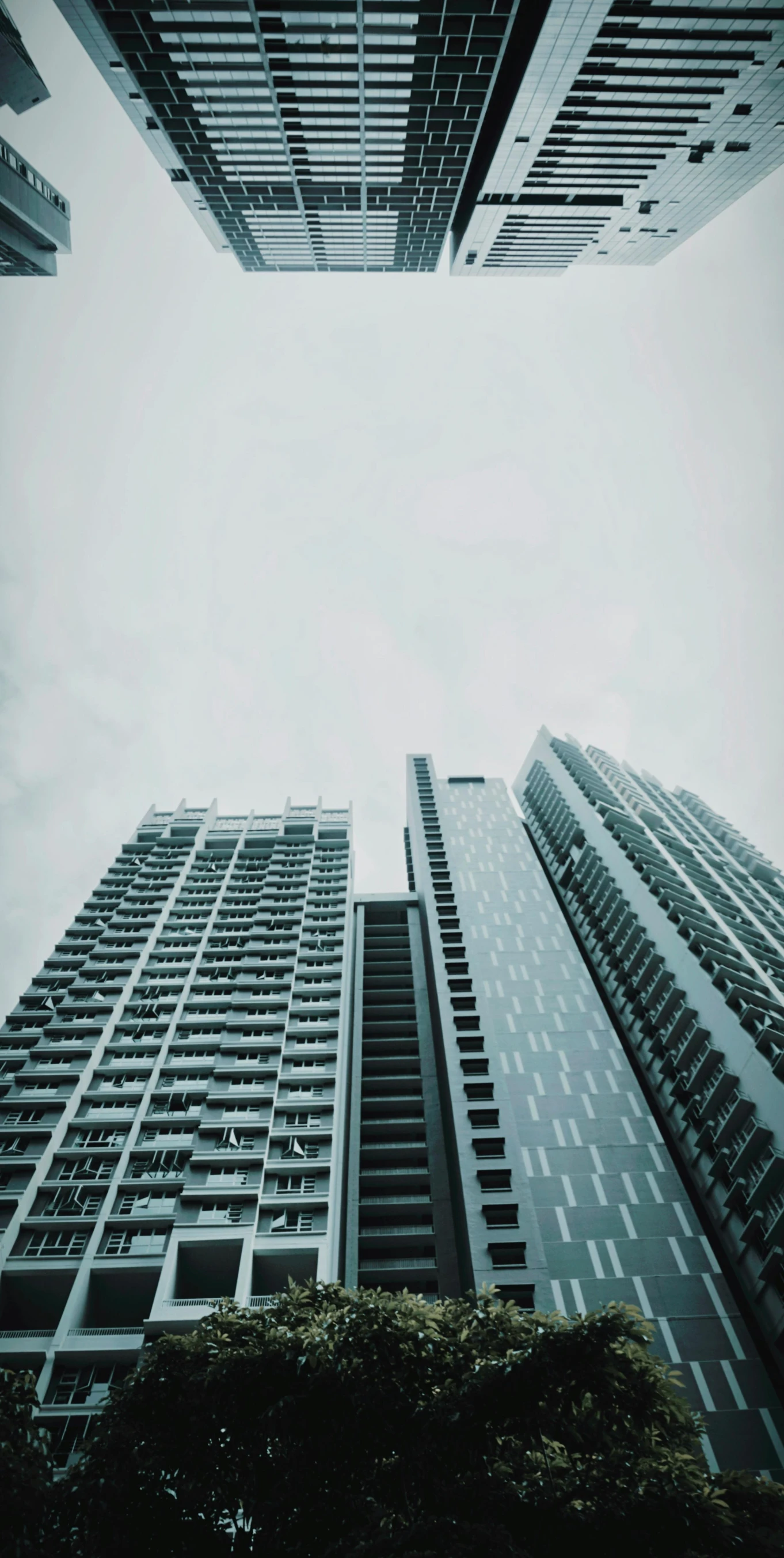 looking up at buildings on a street from below