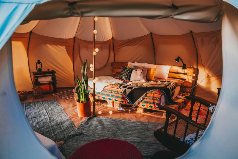 inside view of tented room with wooden furnishings