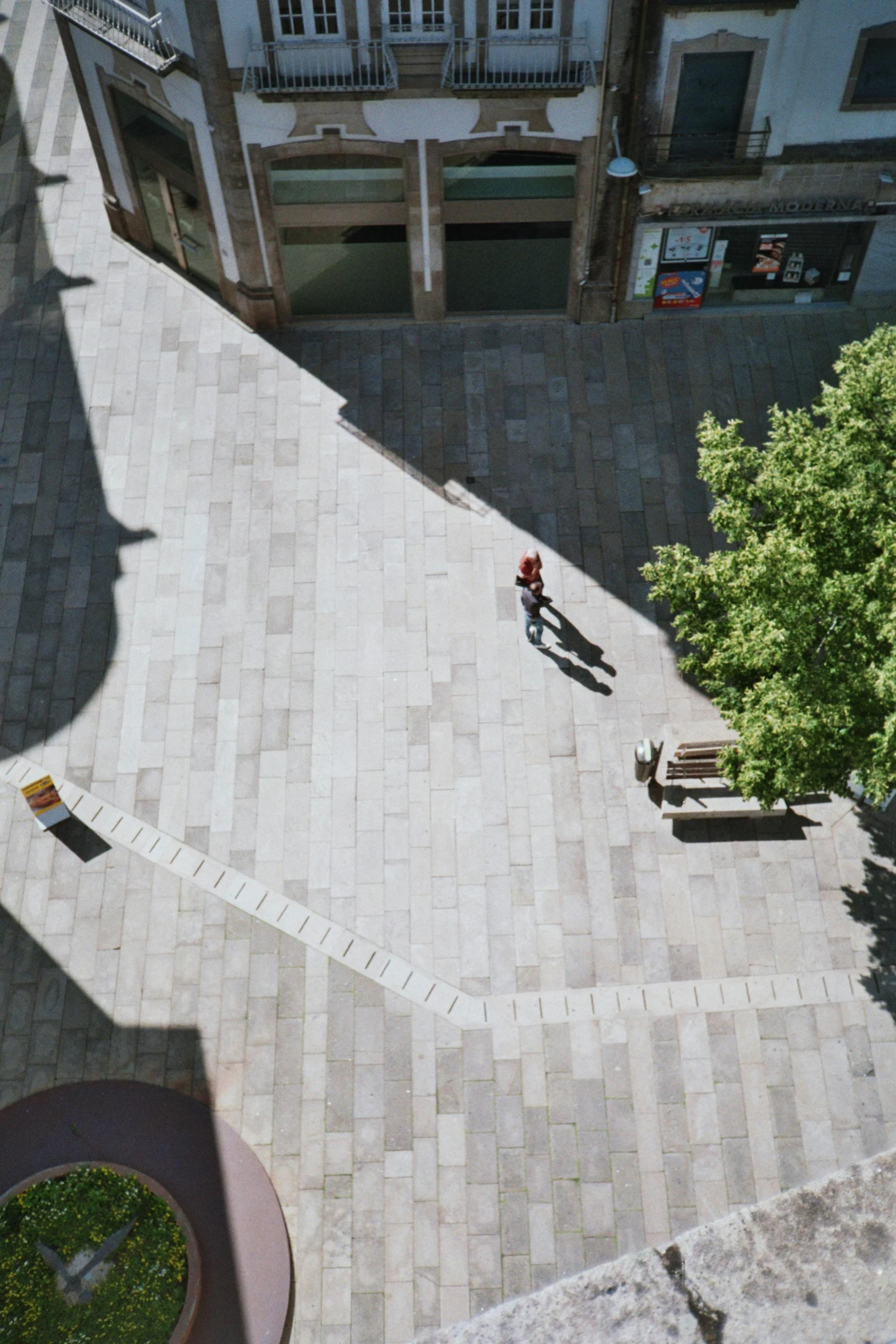 the view of the floor and the back corner of an apartment building