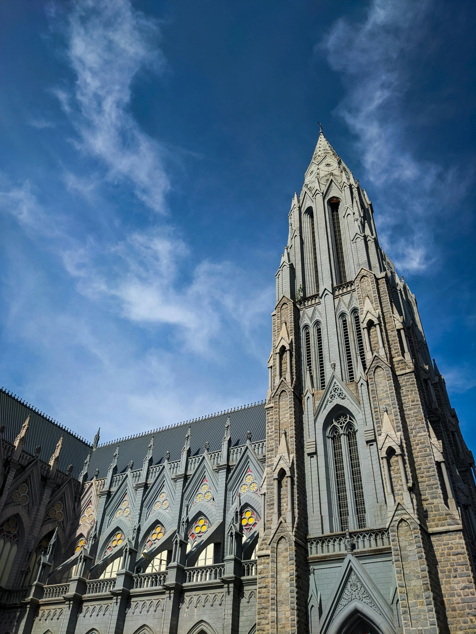 a building with a tall tower made of stone