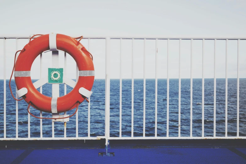a life preserver is attached to a fence on a boat