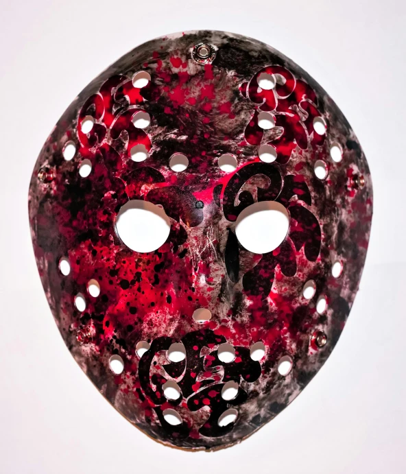 the mask with holes and rivets is red