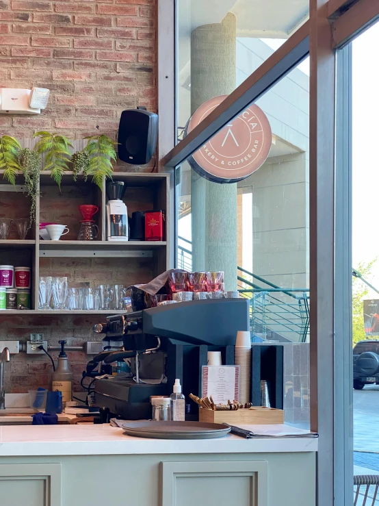 an espresso machine sitting on top of a counter in a cafe