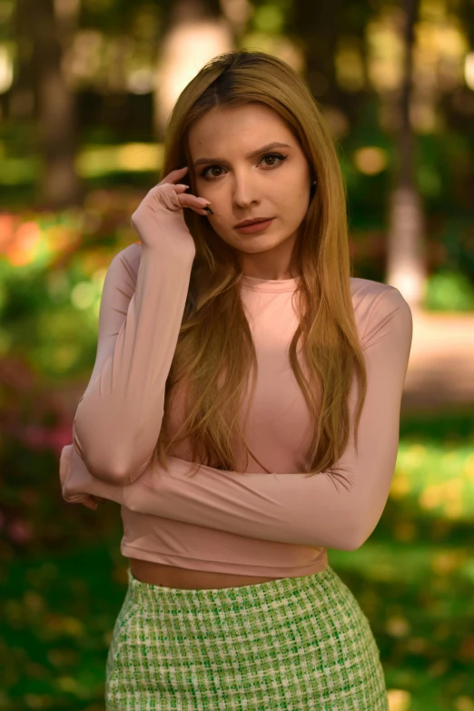  posing in a park wearing a skirt