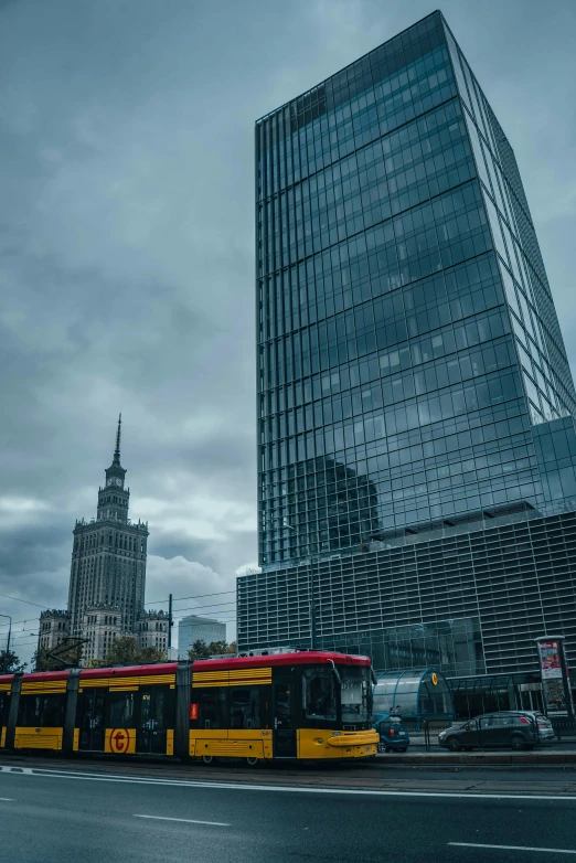 the buses are waiting for passengers on the city street