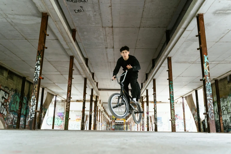 a person jumping a bike on a street