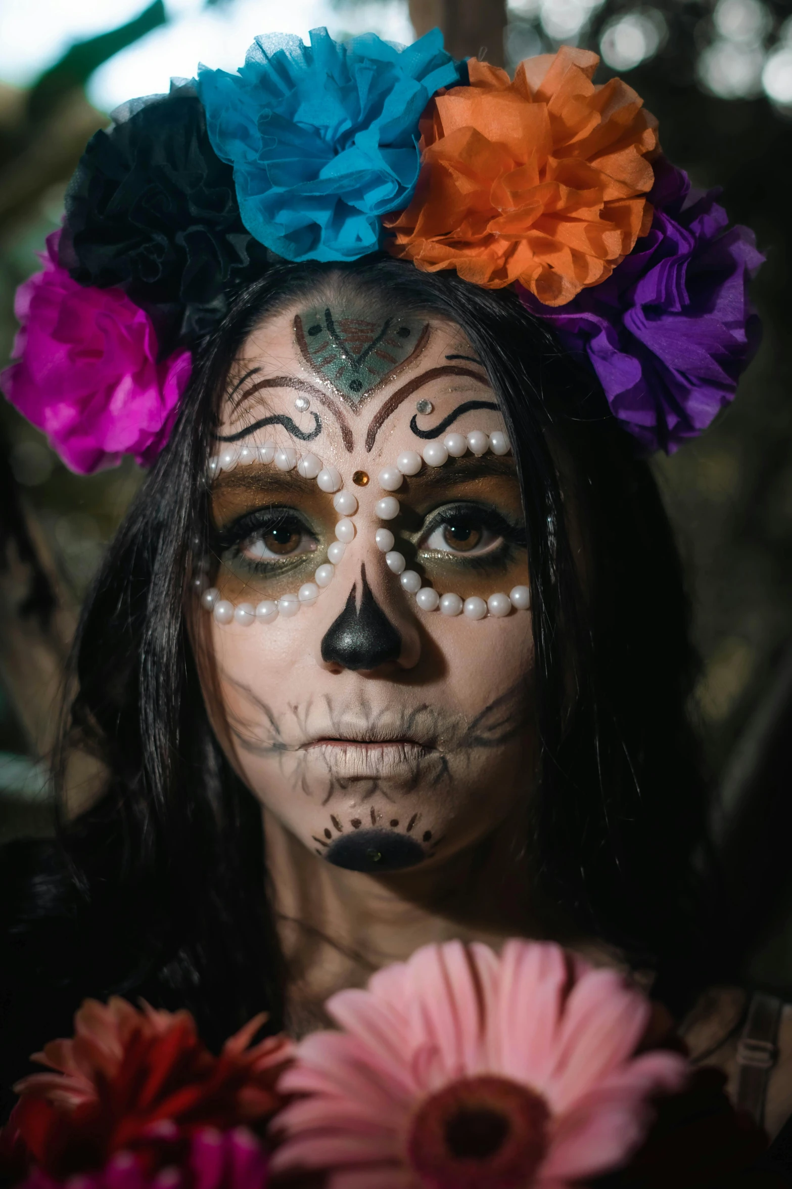 a young woman with makeup and face art