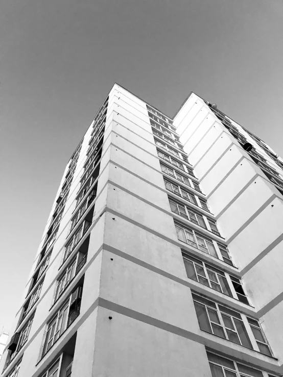 an upward view of a very tall, white building