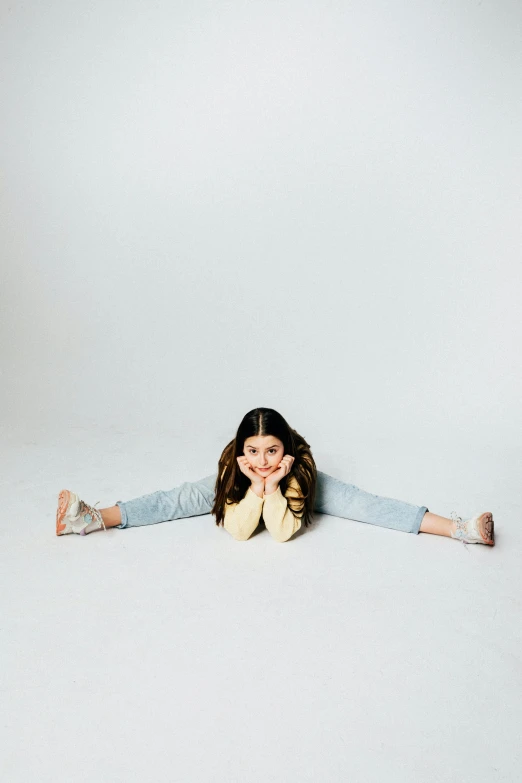 girl laying on the ground with her head behind her arms