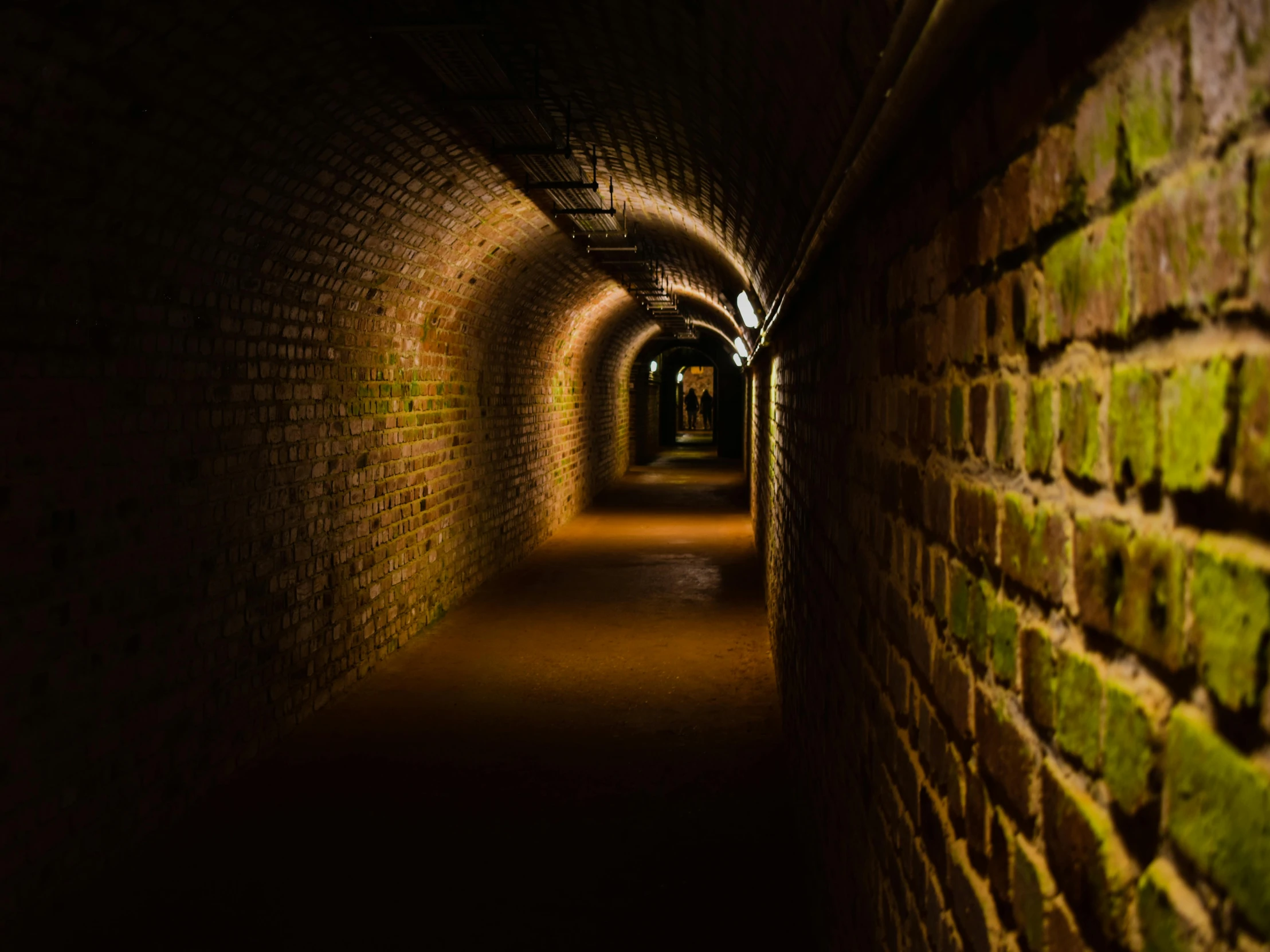 the light from the dark tunnel shows light streaks in the wall