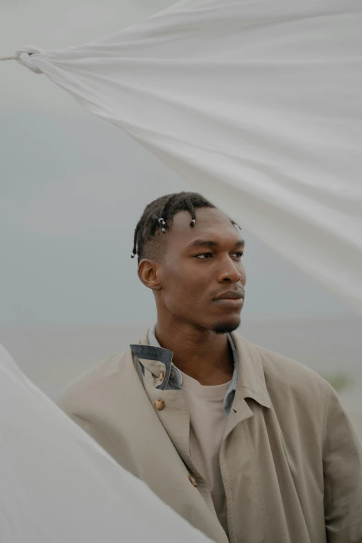 a man wearing an outfit under a canopy