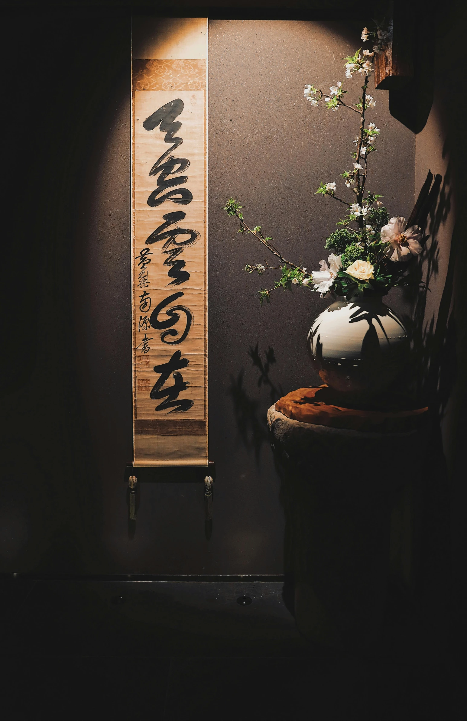 a vase sitting on a wooden table with a sign reading japan