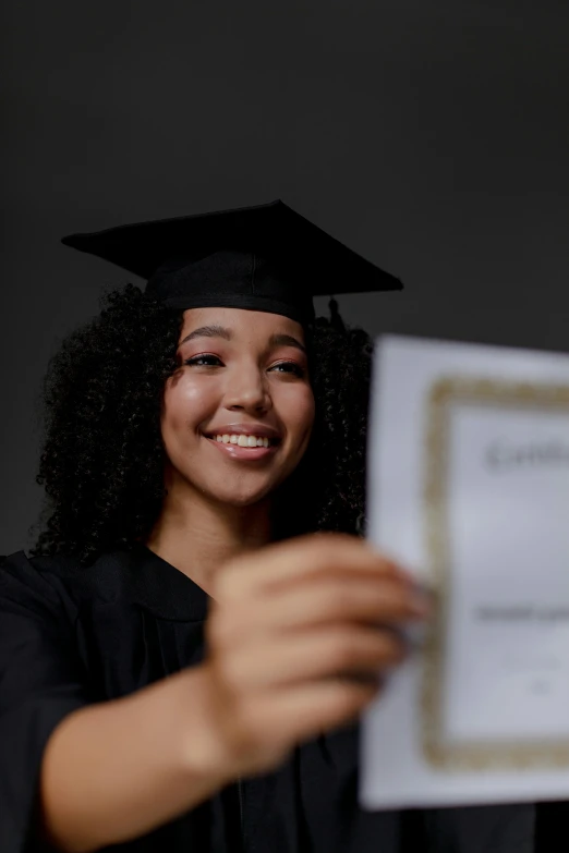 a person that is holding up some kind of paper