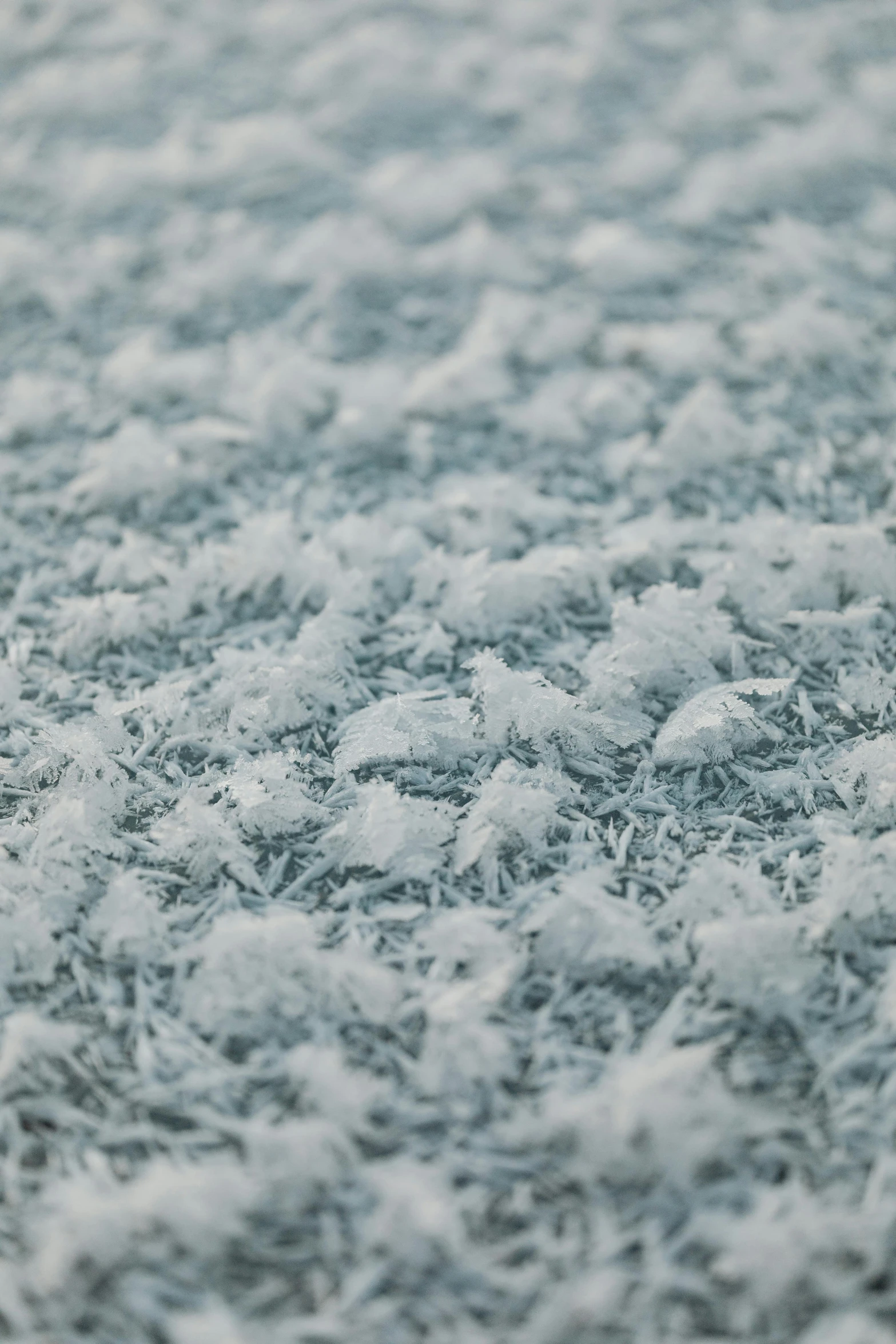 a textured white snow surface with tiny waves