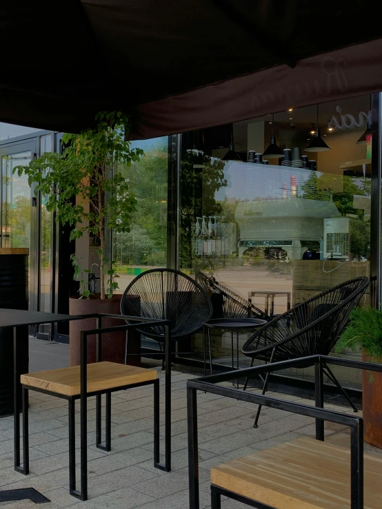 chairs and tables are shown outside a restaurant